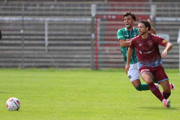 August 26, 2026, Germany, Regionalliga Nord, Soccer, Matchday 1, 2026–2027 Season, Dietmar Scholze Stadium at the Lohmühle, VfB Lübeck vs. SC Weiche Flensburg Dardan Karimani (VfB Lübeck 10) in a tackle against Alexander Laukart (SC Weiche Flensburg 08) July 7 Photo: nordphoto GmbH Tauchnitz Lübeck Dietmar Scholze Stadium an der Lohmühle SH Germany Copyright: xnordphotoxGmbHx xTauchnitzx