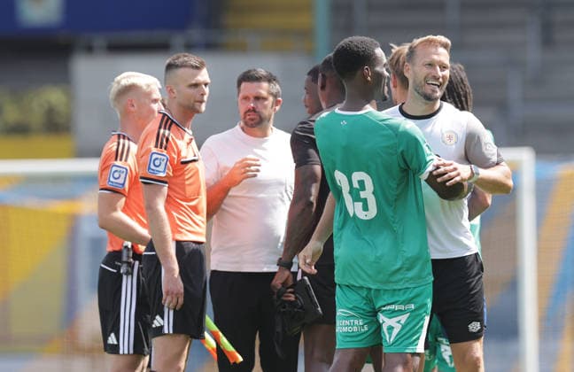 Marc Pfitzner with La Louviere’s former Braunschweig player Patrick Nkoa after the final whistle; Soccer, Men’s, 2026–2027 Season, 2nd Bundesliga, Eintracht Stadium, Eintracht Braunschweig vs. RAAL La Louvière, preseason, friendly match, 0–0. DFL regulations prohibit any use of photographs as image sequences and or quasi-video.