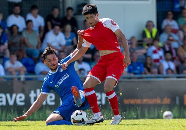 Soccer Regional League, West Division 1, Matchday: SV Westfalia Rhynern vs. Sportfreunde Siegen on August 1, 2026, at the Kümpel Hellmeister Arena in the Westfalia Sportpark in Hamm-Rhynern. Melih Sayin (Rhynern), on the left, Rikuhei Nabesaka (Siegen); on the right xMAx