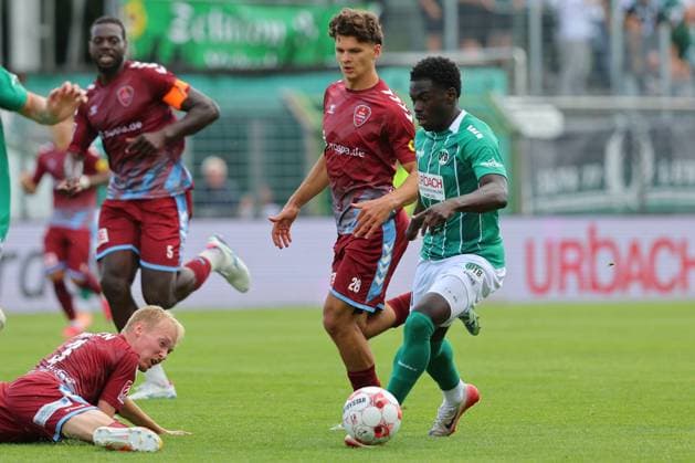 August 26, 2026, GER, Regionalliga Nord, Soccer, Matchday 1, 2026–2027 Season, Dietmar Scholze Stadium an der Lohmuehle, VfB Lübeck vs. SC Weiche Flensburg Emmanuel Appiah (VfB Lübeck 18) in a tackle against Theo Behrmann (SC Weiche Flensburg 08) 28 on the ground Torben Marten (SC Weiche Flensburg 08) 03 Photo: nordphoto GmbH Tauchnitz Lübeck Dietmar Scholze Stadium an der Lohmuehle, SH, Germany Copyright: xnordphotoxGmbHx xTauchnitzx
