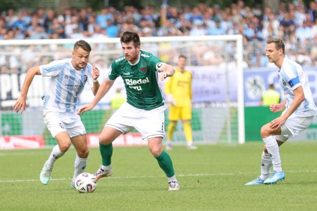 August 1, 2026, Men s Soccer, 2026–2027 Season, Bavarian Regional League, Matchday 2: 1 FC Schweinfurt 1905 vs. TSV 1860 Munich. From left: Raphael Wach (TSV 1860 Munich), 08 behind Kevin Fery of FC Schweinfurt 05, 15 Schweinfurt Riedel Bau Arena at Sachs Stadio, Bavaria, Lower Franconia, Germany