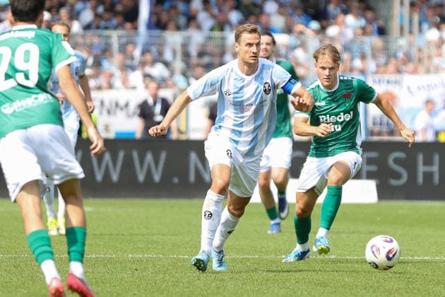 August 1, 2026, Men s, Soccer, 2026–2027 Season, Bavarian Regional League, Matchday 2: 1 FC Schweinfurt 1905 vs. TSV 1860 Munich. From left: Dennis Dressel (TSV 1860 Munich), No. 14, in front of Gil Ebner (FC Schweinfurt 05), 08 Schweinfurt Riedel Bau Arena at Sachs Stadio, Bavaria, Lower Franconia, Germany