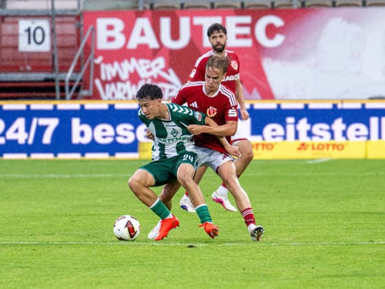 Soccer, Men s, Friendly Match, 2026–2027 Season, FC Energie Cottbus vs. SV Werder Bremen, from left: Patrice Covic (Werder Bremen), Lukas Michelbrink (Energie Cottbus), August 1, 2026, Copyright: xSebastianxRäppold MatthiasxKochx
