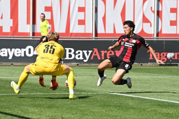 Ibrahim MAZA LEV vs. Goalkeeper Felix WIENAND RWE Action, Tackle, Soccer, Bundesliga 1, Friendly Match, Bayer Leverkusen (LEV) vs. Rot-Weiss Essen on August 1, 2026, in Leverkusen, Germany. DFL regulations prohibit any use of photographs as image sequences and or quasi-video.