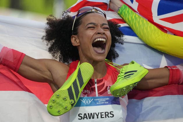 RECORD DATE NOT STATED 1st August 2026; Glasgow, Scotland; 2026 Commonwealth Games, Day Ten; Jazmin Sawyers of England celebrates winning the Womens long jump final with a England flag AlecxBrown