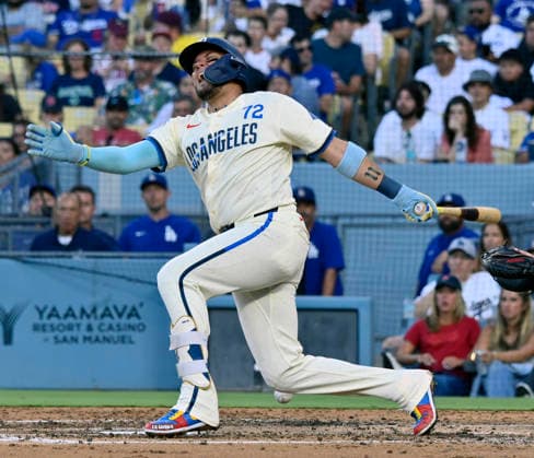 Los Angeles Dodgers shortstop Moguel Rojas grimaces after hitting the ball off his leg in the fourth inning at Dodger Stadium against the Boston Red Sox in Los Angeles on Saturday, August 1, 2026.  LAP2026080116 JIMxRUYMEN