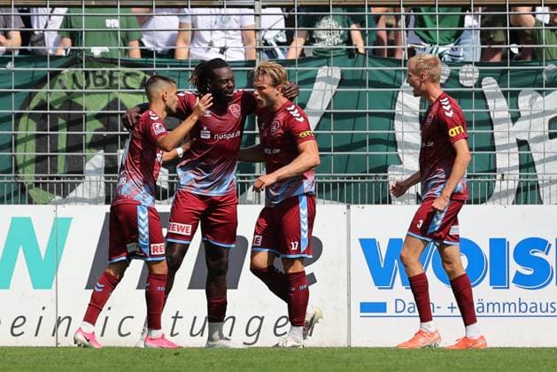 August 26, 2026, GER, Regionalliga Nord, Soccer, Matchday 1, 2026–2027 Season, Dietmar Scholze Stadium at the Lohmuehle, VfB Lübeck vs. SC Weiche Flensburg Goal celebration Cheering Goal scorer(s) Kevin Ntika SC Weiche Flensburg 08 05 celebrates the goal that tied the game at 1–1 Photo: nordphoto GmbH Tauchnitz Lübeck Dietmar Scholze Stadium an der Lohmuehle, SH, Germany Copyright: xnordphotoxGmbHx xTauchnitzx