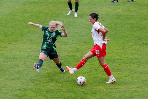 August 1, 2026, xgrfx, Women’s Soccer Friendly Match, RB Leipzig vs. VfL Wolfsburg, featuring Thea Bjelde (VfL Wolfsburg) and Emanuela Pfister (RB Leipzig). DFL and DFB regulations prohibit any use of photographs as image sequences and or quasi-video. Leipzig