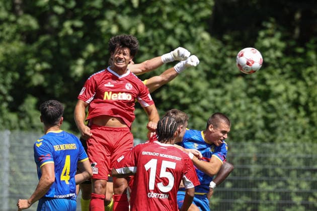 Soccer I Men I 2026–2027 Season I Regionalliga Nord I Matchday 1 I Eintracht Norderstedt vs. SV Atlas Delmenhorst I August 2, 2026 Alejo Romero 4, SV Atlas Delmenhorst Fabian Grau 4, FC Eintracht Norderstedt Lars Huxsohl 1, FC Eintracht Norderstedt punches the ball away, Tobias Fagerström 9, SV Atlas Delmenhorst Copyright: xLobeca RalfxHomburgx