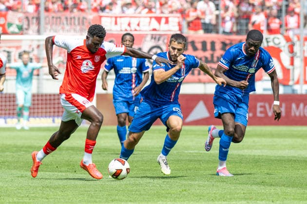 Regionalliga Northeast, Season 26–27: Hallescher FC vs. FC Rot Weiss Erfurt, Halle, Germany, August 2, 2026. Pictured from left, in a tackle: Bocar Baro (Halle), Sofiane Ikene (Erfurt), and Benjika Caciel (Erfurt). Halle Saale Leuna Chemie Stadium, Saxony-Anhalt, Germany
