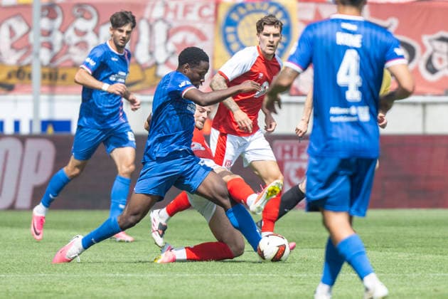 Regionalliga Northeast, Season 26–27: Hallescher FC vs. FC Rot Weiss Erfurt, Halle, Germany, August 2, 2026. Pictured from left, in a tackle: Benjika Caciel (Erfurt), Max Kulke (Halle), and Niclas Stierlin (Halle). Halle-Saale Leuna Chemie Stadium, Saxony-Anhalt, Germany