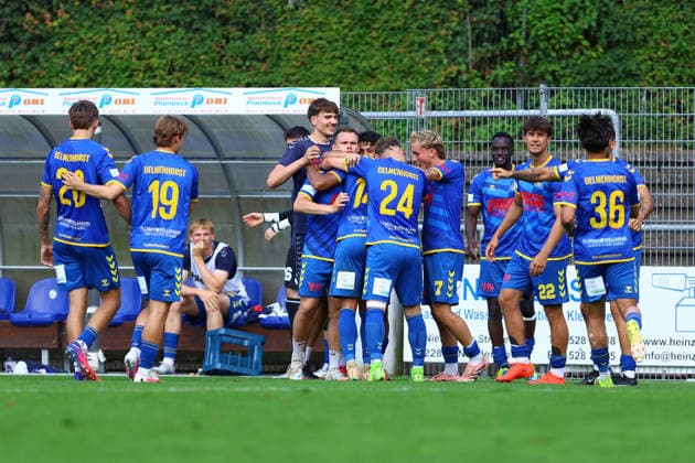 14 Lamine Diop of SV Atlas Delmenhorst celebrates his goal—making the score 2–2—with his teammates. Soccer Men’s Regionalliga Nord 2026–2027 Season Matchday 1 FC Eintracht Norderstedt vs. SV Atlas Delmenhorst August 2, 2026 2026 Edmund Plambeck Stadium