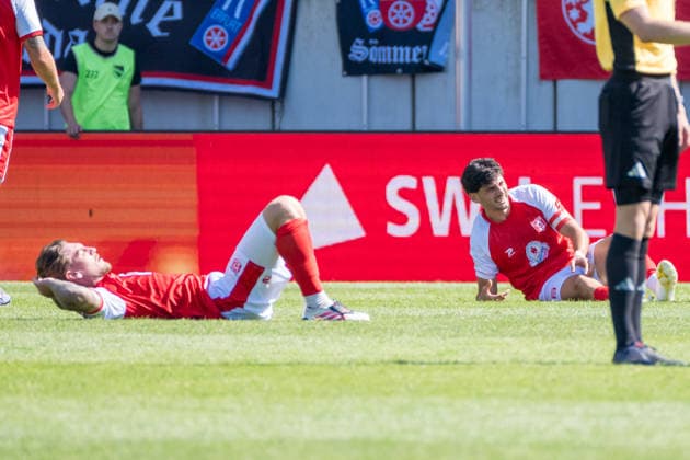 Niclas Stierlin (HFC), 13, and Burim Halili (HFC), 5, on the ground after the final whistle, Hallescher FC vs. FC Rot Weiss Erfurt, soccer, Northeast Regional League, Matchday 2, 2026–27 season, August 2, 2026, Halle Leuna Chemie Stadium, ST Deutschland