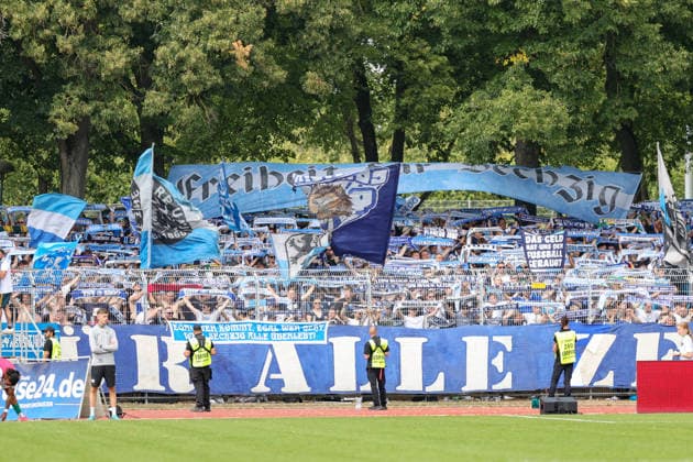 August 1, 2026, Men s Soccer, 2026–2027 Season, Bavarian Regional League, Matchday 2: 1 FC Schweinfurt 1905 vs. TSV 1860 Munich. TSV 1860 Munich fans in the visitors section with flags and scarves. Schweinfurt Riedel Bau Arena at Sachs Stadio, Bavaria, Lower Franconia, Germany