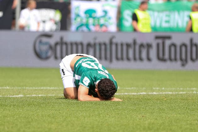 August 1, 2026, Men s Soccer, 2026–2027 Season, Bavarian Regional League, Matchday 2: 1 FC Schweinfurt 1905 vs. TSV 1860 Munich; Mustafa Alper Özden of FC Schweinfurt 05, No. 20, lying on the ground injured; single frame from the Schweinfurt Riedel Bau Arena at the Sachs Stadio, Bavaria, Lower Franconia, Germany