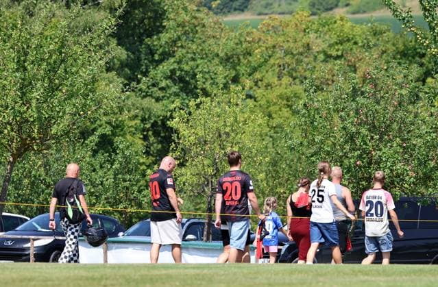 GER, Bayer 04 Leverkusen Training Camp in Blankenhain, August 3, 2026, Blankenhain, GER, 2026–2027 Season, Bundesliga 1, Bayer 04 Leverkusen Training Camp in Pictures: Fans in Leverkusen Jerseys Leave the Training Grounds. DFL regulations prohibit any use of photographs as image sequences and or quasi-video.