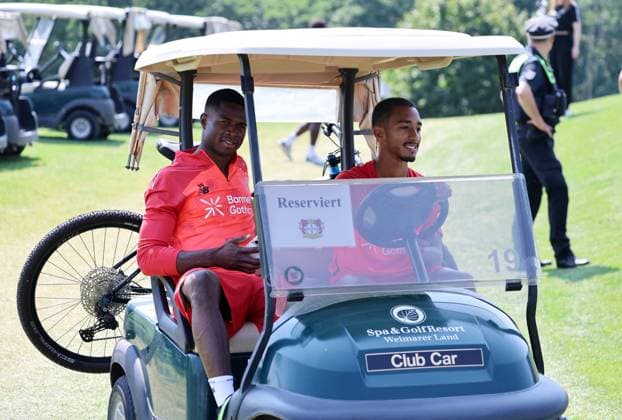GER, Bayer 04 Leverkusen Training Camp in Blankenhain, August 3, 2026, Blankenhain, GER, 2026–2027 Season, Bundesliga 1, Bayer 04 Leverkusen Training Camp in Pictures: Christian Kofane Leverkusen and Arthur Leverkusen in a golf caddy. DFL regulations prohibit any use of photographs as image sequences and or quasi-video.