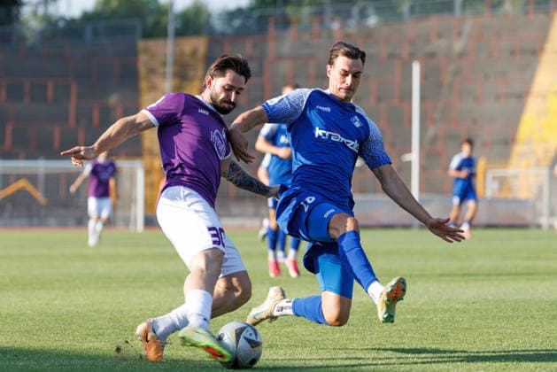 Levis Schaber, 30, of TSV Schwaben Augsburg, and Eduard Heckmann, 23, of FV Illertissen, during the match between TSV Schwaben Augsburg and FV Illertissen, soccer, men’s, Toto Cup, 2026–2027, Matchday 1 on August 4, 2026, in Augsburg, Rosenaustadion, Bavaria, Germany