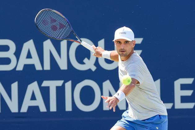 MONTREAL, QC - AUGUST 04: Marcos Giron (USA) returns the ball during a first round match at National Bank Open on August 04, 2026 at IGA Stadium in Montreal, QC (Photo by David Kirouac Icon Sportswire) TENNIS: AUG 04 National Bank Open EDITORIAL USE ONLY Icon26080402426