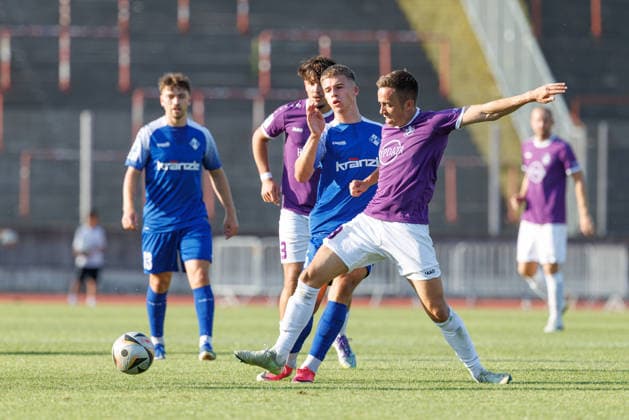Marco Luburic 23, TSV Schwaben Augsburg, and Alessio Hasler 5, FV Illertissen, in the match between TSV Schwaben Augsburg and FV Illertissen, soccer, men s, Toto Cup, 2026–2027, Matchday 1 on August 4, 2026, in Augsburg, Rosenaustadion, Bavaria, Germany