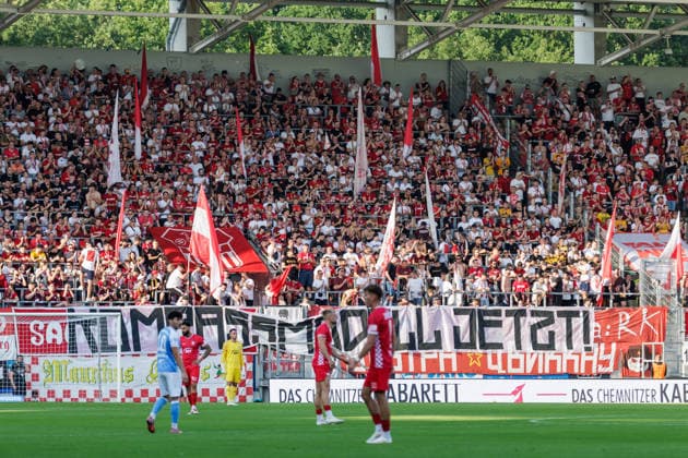 August 4, 2026, GER, Regionalliga North East, Matchday 3, 2026–2027 season, Chemnitz, Chemnitzer FC vs. FSV Zwickau. FSV Zwickau fans with a banner supporting promotion reform. Chemnitz Eins Stadium, An der Gellertstraße, Saxony, Germany Copyright: xnordphotoxGmbHx xTrienitzx