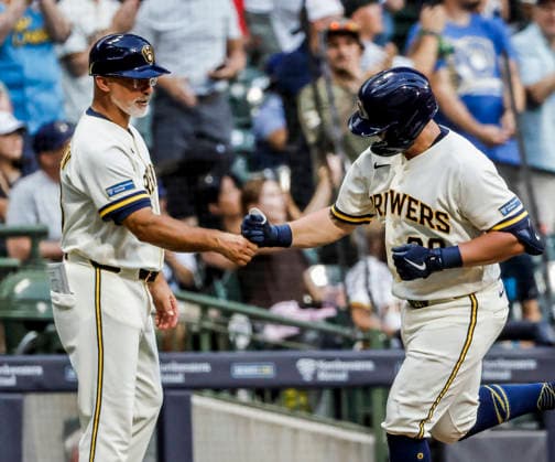 Milwaukee Brewers first baseman Andrew Vaughn celebrates with Milwaukee Brewers third base coach Matt Erickson after hitting a home run in the fourth inning of the MLB, Baseball Herren, USA game between the Pittsburgh Pirates and the Milwaukee Brewers at American Family Field in Milwaukee, Wisconsin on Tuesday, August 4, 2026.  MIL20260804817 TANNENxMAURY