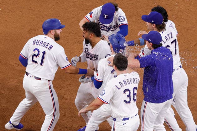 August 4, 2026, Arlington, Texas, USA: Texas Rangers third baseman EZEQUIEL DURAN (20) gets a drink shower after hitting the walk-off winner in a baseball game, Tuesday, Aug. 4, 2026, in Arlington, Texas. Arlington USA - ZUMAa325 20260804_zsa_a325_007 Copyright: xDavidxBalleringxIix