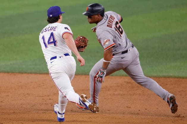 August 4, 2026, Arlington, Texas, USA: Texas Rangers second baseman JUSTIN FOSCUE (14) tags out San Francisco Giants first baseman RAFAEL DEVERS (16) in a baseball game, Tuesday, Aug. 4, 2026, in Arlington, Texas. Arlington USA - ZUMAa325 20260804_zsa_a325_020 Copyright: xDavidxBalleringxIix