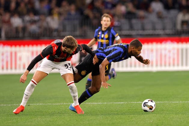 SOCCER AC MILAN INTER, Andy Diouf of Inter Milan is tackled by Davide Bartesaghi of AC Milan during the AC Milan vs Inter Milan soccer exhibition match at Optus Stadium in Perth, Wednesday, August 5, 2026. ( NO ARCHIVING PERTH WESTERN AUSTRALIA AUSTRALIA  Copyright: xRICHARDxWAINWRIGHTx 20260805158777728557