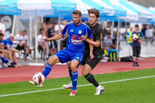August 5, 2026, xydrx, Soccer, Friendly Match, FC Rottach Egern vs. Borussia Mönchengladbach, 2026–2027 Season, Birkenmoos Stadium, Florian Mex (FC Rottach Egern), No. 9 in a tackle against Daiki Hashioka (Borussia Mönchengladbach), No. 14. DFB regulations prohibit any use of photographs as image sequences and or quasi-video. Copyright: HMBxMedia YannisxDreimann
