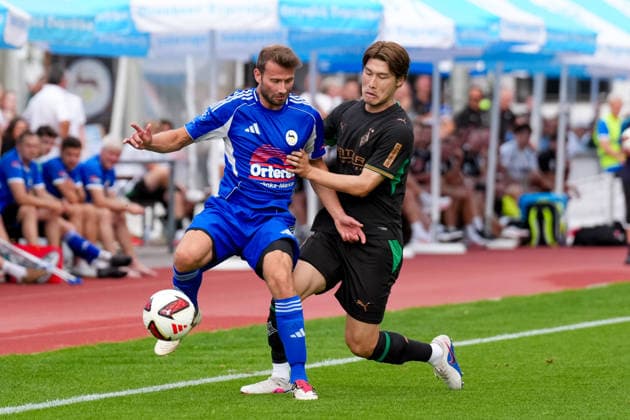 August 5, 2026, xydrx, Soccer, Friendly Match, FC Rottach Egern vs. Borussia Mönchengladbach, 2026–2027 Season, Birkenmoos Stadium, Florian Mex (FC Rottach Egern), No. 9 in a tackle against Daiki Hashioka (Borussia Mönchengladbach), No. 14. DFB regulations prohibit any use of photographs as image sequences and or quasi-video. Copyright: HMBxMedia YannisxDreimann