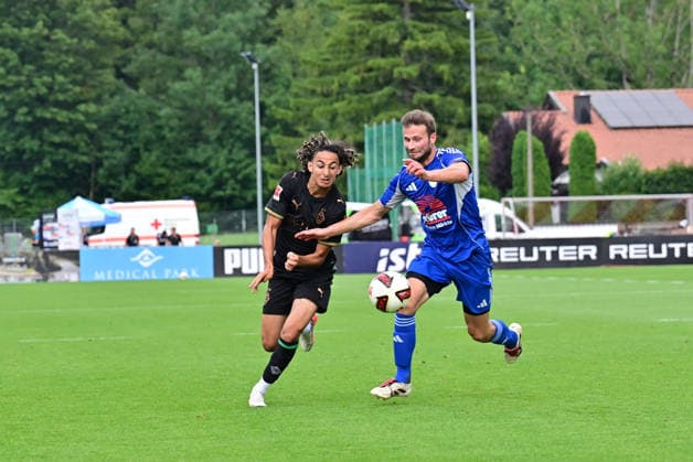 August 5, 2026 Rottach Egern Soccer, Men s, 2026–2027 season, Friendly Match: FC Rottach Egern vs. Borussia Mönchengladbach. Tackle between (from left) Wael Mohya (Gladbach) and Julian Wiefern (Rottach). DFL regulations prohibit any use of photographs as image sequences and or quasi-video. Am Birkenmoos Stadium, Bavaria, Germany
