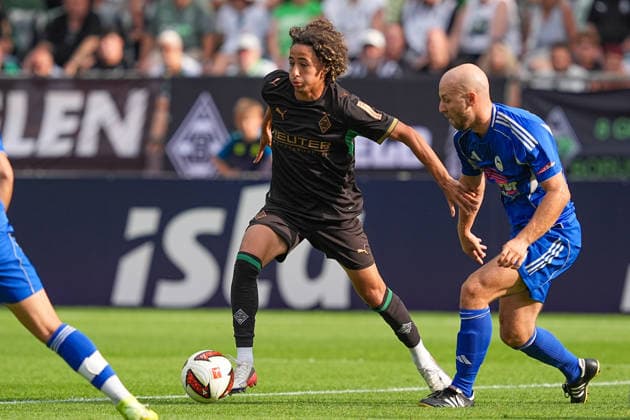 August 5, 2026, xydrx, soccer, friendly match, FC Rottach Egern vs. Borussia Mönchengladbach, 2026–2027 season, Birkenmoos Stadium, Wael Mohya (Borussia Mönchengladbach), No. 36 in a tackle against Markus Stoeckl (FC Rottach Egern), 2. DFB regulations prohibit any use of photographs as image sequences and or quasi-video Copyright: HMBxMedia YannisxDreimann