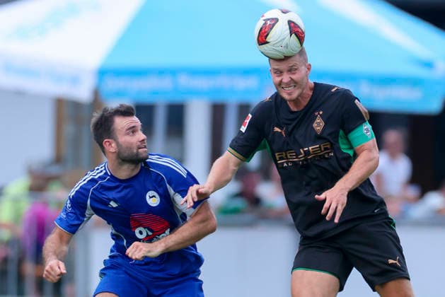 Julian Wiefarn of FC Rottach Egern and Nico Elvedi of Borussia Mönchengladbach battle for the ball during the friendly match between FC Rottach Egern and Borussia Mönchengladbach at Birkenmoos Stadium on August 5, 2026, in Rottach Egern, Germany. Photo by Marco Steinbrenner, DeFodi Images. Julian Wiefarn of FC Rottach Egern and Nico Elvedi of Borussia Mönchengladbach battle for the ball during the friendly match between FC Rottach Egern and Borussia Mönchengladbach at Stadion Birkenmoos on August 5, 2026 in Rottach Egern, Germany. Photo by Marco Steinbrenner, DeFodi Images. Photo by Marco Steinbrenner, DeFodi Images.