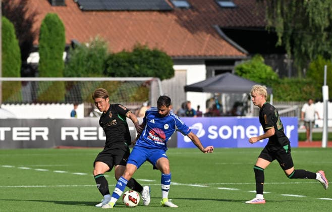 August 5, 2026 Rottach Egern Soccer, Men s, 2026–2027 Season, Friendly Match: FC Rottach Egern vs. Borussia Mönchengladbach. A tackle between (from left) Zento Uno (Gladbach) and Samet Yilmazer (Rottach); on the far right, Fritz Fleck (Gladbach) watches the action. DFL regulations prohibit any use of photographs as image sequences and or quasi-video. Am Birkenmoos Stadium, Bavaria, Germany