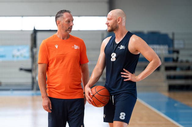 easycredit BBL Basketball Bundesliga 2026–2027 Media Training at Science City Jena on August 6, 2026; from left, Head Coach Steven Esterkamp in conversation with player Robin Christen at Sparkassen Arena