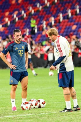 August 6, 2026, Hong Kong, Kaohsiung City, China: RaphaoÂ«l Guerreiro of FC Bayern Munich listens as a coach gestures before a shooting drill during the team s pre-match warm-up ahead of the Audi Football Summit 2026 match against Aston Villa at Kai Tak Stadium in Hong Kong, China. Audi Football Summit 2026 FC Bayern Munich Vs Aston Villa  - ZUMAh201 20260806_zsp_h201_016 Copyright: xYichinxHoux