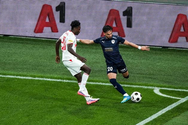 Soccer Austria UEFA Europa League Qualifying 2026–2027, Round 3, August 6, 2026: FC Red Bull Salzburg (Austria) vs. Pafos FC (Cyprus) at Red Bull Arena, Wals-Siezenheim, Austria; Edmund Baidoo (FC Salzburg), Gabriel Biel (Pafos FC) Copyright: xLUKAxKOLANOVICx