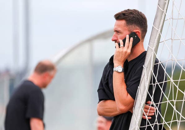 August 7, 2026, Germany, Grassau, Bundesliga, 2026–2027 season, VfB Stuttgart training camp, sporting director Christian Gentner on the phone, cell phone
