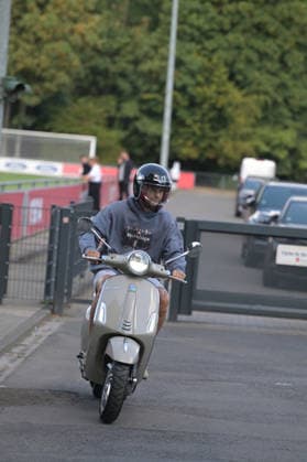 August 7, 2026, xophax, Soccer, Bundesliga 1, 1. FC Köln Training on Field 1 at Geissbockheim; the pros train ahead of the evening match against Real San Sebastian; Joel Schmied of 1. FC Köln rides his Vespa scooter to training in Kitzbühel