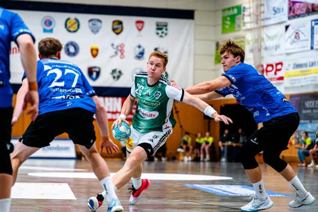 August 7, 2026, xdobgx, 2026 Heide Cup Handball Tournament, TSV Hannover Burgdorf vs. Mors Thy Handball; from left: Jonathan Edvardsson of TSV Hannover Burgdorf, No. 26, in possession of the ball, plays the ball