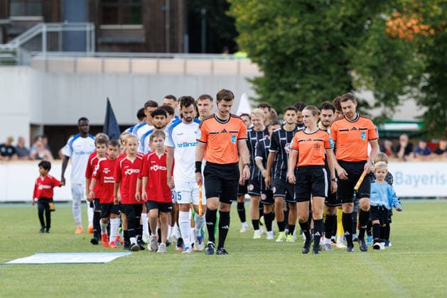 Davina Lutz (referee), Kevin Rösch (assistant referee), and Christoph Stühler (assistant referee) will lead the teams onto the field for the match between TSV Landsberg and FV Illertissen 1921, Soccer, Men’s, Bavarian Regional League, 2026–2027, Matchday 3 on August 7, 2026, in Landsberg am Lech, Sportpark, Bavaria, Germany
