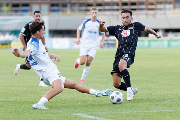 Furkan Kircicek, 19, TSV Landsberg, and Jordi Wegmann, 19, FV Illertissen 1921, during the match between TSV Landsberg and FV Illertissen 1921, soccer, men’s, Bavarian Regional League, 2026–2027, Matchday 3 on August 7, 2026, in Landsberg am Lech, Sportpark, Bavaria, Germany
