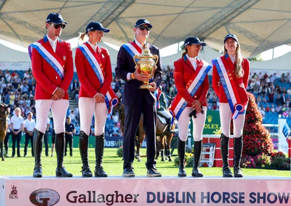 2026 Dublin Horse Show, Laya Arena, Dublin 7 8 2026 Nations™ Cup of Ireland for award of the Aga Khan Trophy The United States of America team celebrate on the winners podium with the Aga Khan Trophy The United States of America team celebrate on the winners podium with the Aga Khan Trophy 7 8 2026  Copyright: xx DC3A9805
