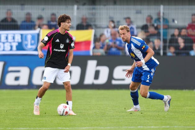 August 7, 2026, Soccer, Men s, Regionalliga Nord, Matchday 2, BSV Kickers Emden vs. Hamburger SV II; Peer Mahncke (blue, 5) of BSV Kickers Emden in a tackle with Alessandro Puzzo (14) of Hamburger SV II