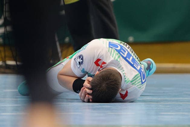 August 7, 2026, xtgx, Handball Tournament, EHV Aue vs. SC Magdeburg emspor, from left: Elvar Orn Jonsson (Magdeburg), 19 injured, injury, Auge Lößnitz