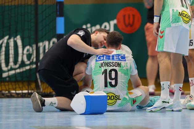 August 7, 2026, xtgx, Handball Tournament, EHV Aue vs. SC Magdeburg emspor, from left: Elvar Orn Jonsson (Magdeburg), 19 injured, injury, Auge Lößnitz