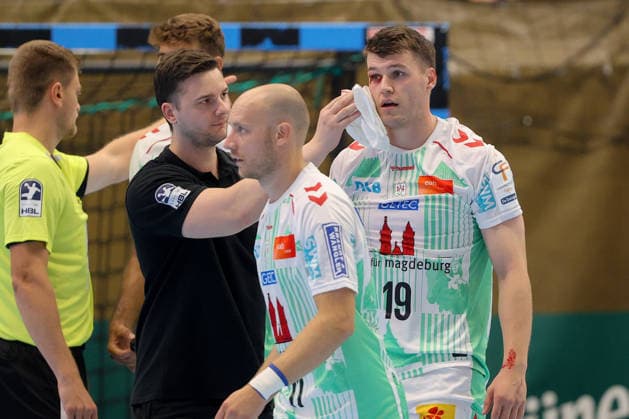 August 7, 2026, xtgx, Handball Tournament, EHV Aue vs. SC Magdeburg emspor, from left: Elvar Orn Jonsson (Magdeburg), 19 injured, injury, Auge Lößnitz