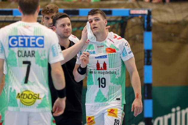 August 7, 2026, xtgx, Handball Tournament, EHV Aue vs. SC Magdeburg emspor, from left: Elvar Orn Jonsson (Magdeburg), 19 injured, injury, Auge Lößnitz