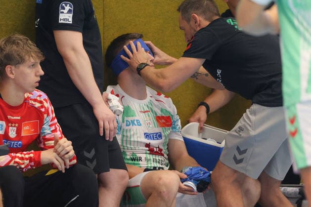 August 7, 2026, xtgx, Handball Tournament, EHV Aue vs. SC Magdeburg emspor, from left: Elvar Orn Jonsson (Magdeburg), 19 injured, injury, Auge Lößnitz